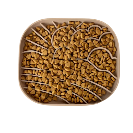 Square silicone slow feeder filled with pet food.