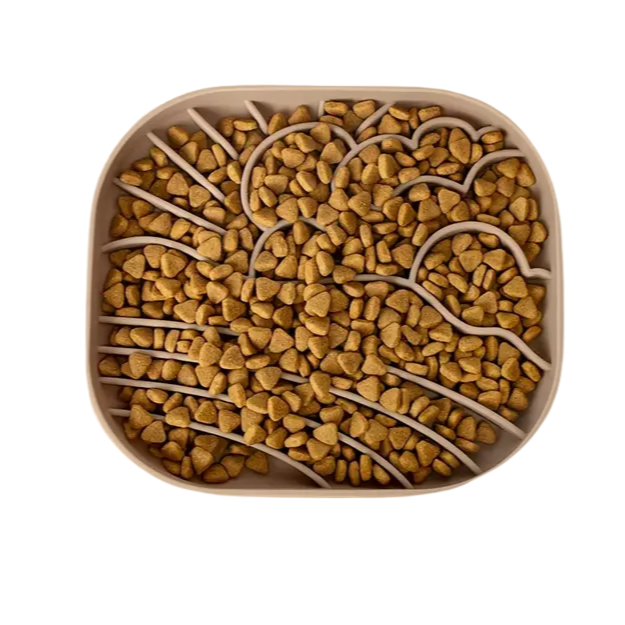 Square silicone slow feeder filled with pet food.